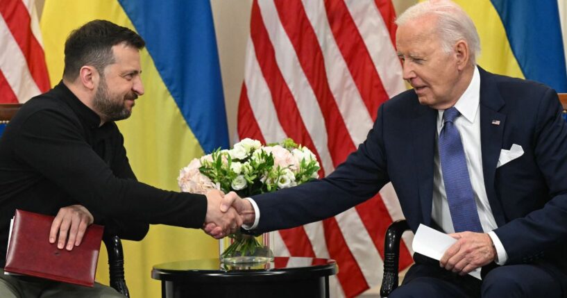 Ukrainian President Volodymyr Zelenskyy, left, shakes hands with then-Ppresident Joe Biden on June 7, 2024, during a bilateral meeting in Paris.