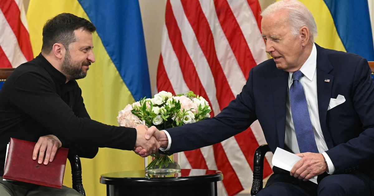 Ukrainian President Volodymyr Zelenskyy, left, shakes hands with then-Ppresident Joe Biden on June 7, 2024, during a bilateral meeting in Paris.