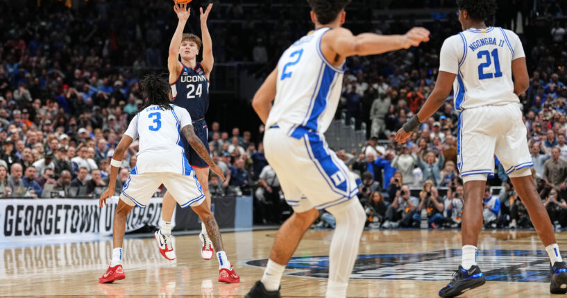 A guard playing for the University of Connecticut scores the winning basket in a game against Duke in the Elite Eight of the NCAA college basketball tournament on March 29, 2026.