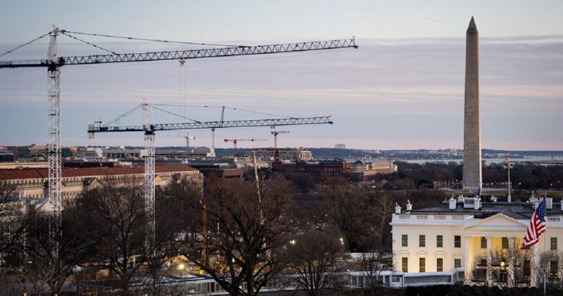 Cranes mark the D.C. skyline as part of construction on the new ballroom extension of the White House in January.