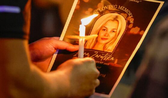 An image of murder victim Iryna Zarutska is pictured on a pamphlet at a vigil in her honor in September in Charlotte, North Carolina.