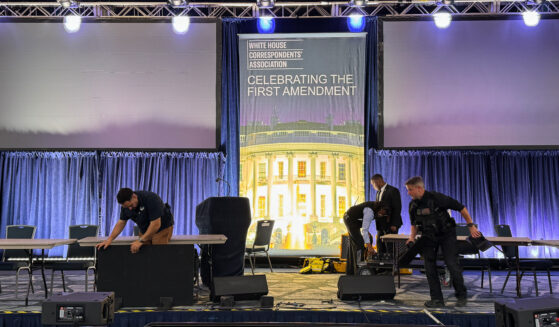 Staff clear out the White House Correspondents’ Dinner stage on April 25, 2026.