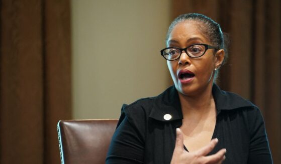 Rep. Karen Whitsett speaks as President Donald Trump, Vice President Mike Pence, and members of the Coronavirus Task Force listen during a meeting with patients in the Cabinet Room of the White House in Washington, D.C., on April 14, 2020.
