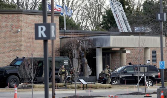 Law enforcement remain on site at the Temple Israel synagogue in West Bloomfield, Michigan, a Detroit suburb, on March 12, 2026, after an assailant drove a vehicle into the building.