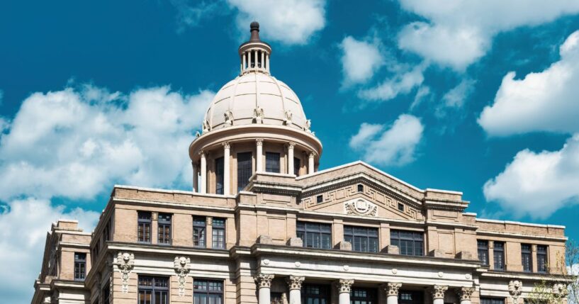 The Harris County Courthouse in downtown Houston, Texas, on a sunny day.