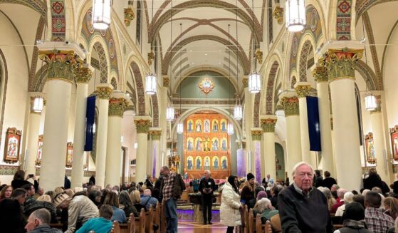 An audience waits in St Francis Cathedral for a Christmas concert to start on Dec. 9, 2025, in Santa Fe, New Mexico.