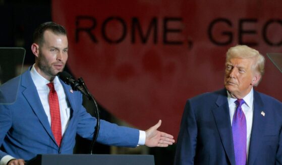 President Donald Trump looks on as Republican congressional candidate Clay Fuller speaks at the Coosa Steel Corporation on Feb. 19, 2026, in Rome, Georgia.