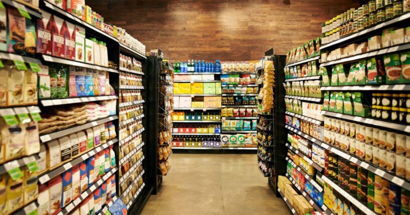 A fully stocked grocery store during the day.
