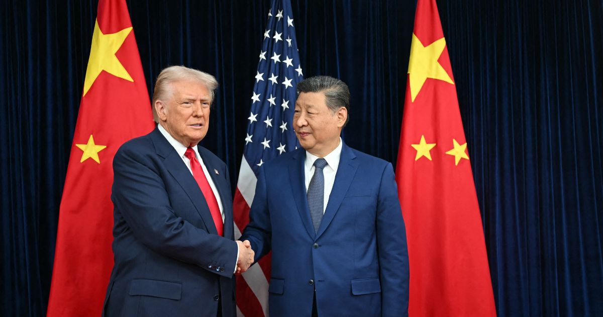 President Donald Trump and Chinese President Xi Jinping shake hands as they arrive for talks at the Gimhae Air Base, located next to the Gimhae International Airport in Busan on Oct. 30, 2025.