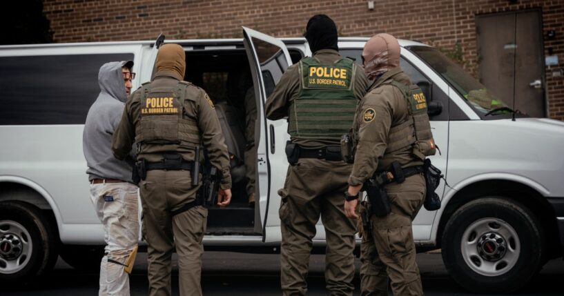 People detained earlier in the day are taken to a parking lot on the far north side of the city before being transferred to an Immigration and Customs Enforcement facility on Oct. 31, 2025, in Chicago, Illinois.