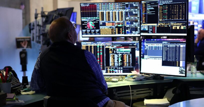 A trader works on the floor of the New York Stock Exchange during the opening bell in New York, on April 13, 2026.