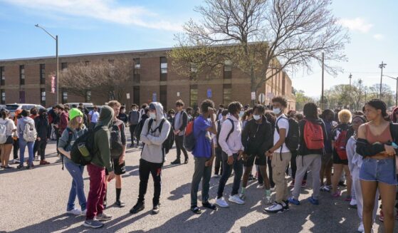 Mt. Vernon High School students participate in a student walkout against the potential confirmation of Superintendent Michelle Reid in Alexandria, Virginia, on April 14, 2022.
