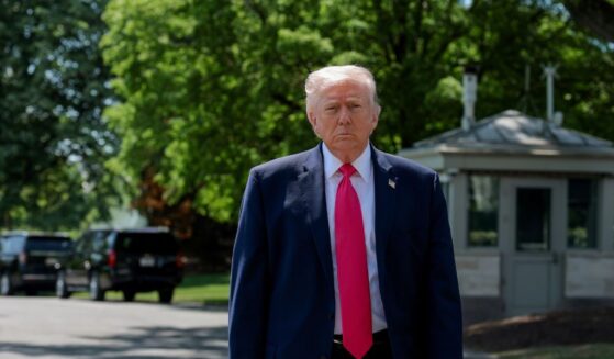 President Donald Trump walks over to speak to the media before boarding Marine One on the South Lawn of the White House on April 16, 2026, in Washington, D.C.