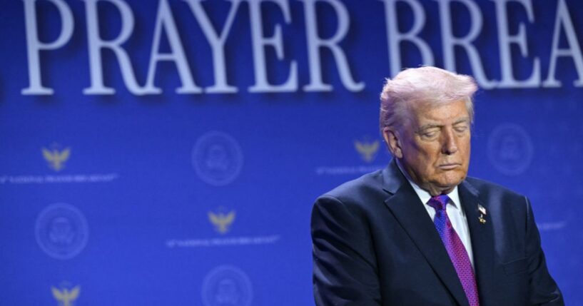 President Donald Trump bows his head in prayer during the National Prayer Breakfast at the Washington Hilton in Washington, D.C., on Feb. 5, 2026.