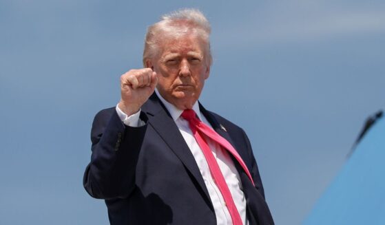 President Donald Trump gestures as he boards Air Force One on April 16, 2026, at Joint Base Andrews, Maryland.