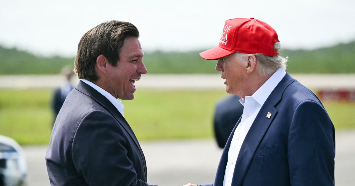 Florida Gov. Ron DeSantis shakes hands with President Donald Trump upon Trump's arrival at Dade-Collier Training and Transition Airport in Ochopee, Florida, on July 1, 2025.