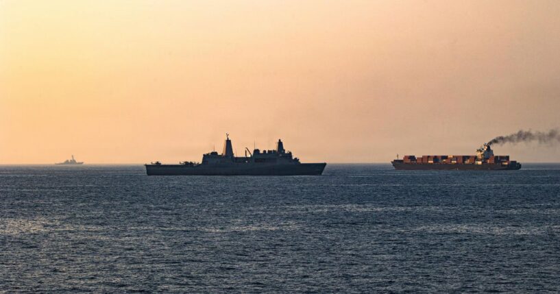 In this handout photo provided by U.S. Central Command, U.S. forces patrol the Arabian Sea near M/V Touska on April 20, 2026, after firing upon the Iranian-flagged vessel that the U.S. accused of attempting to violate the U.S. naval blockade of Iranian ports near the Strait of Hormuz.