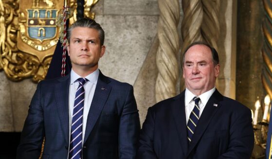 Secretary of War Pete Hegseth and Secretary of the Navy John Phelan stand together as President Donald Trump announced the creation of the “Trump-class” battleship during a statement to the media at Trump’s Mar-a-Lago estate on Dec. 22, 2025, in Palm Beach, Florida.