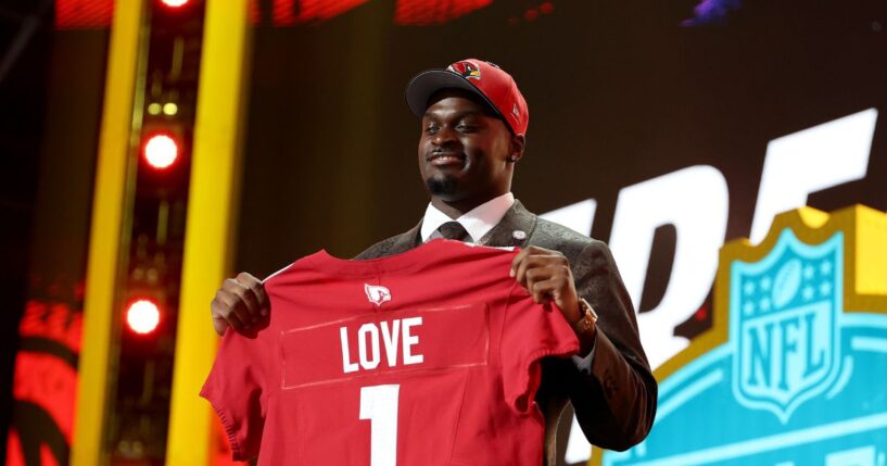 Jeremiyah Love of Notre Dame celebrates after being selected third overall pick by the Arizona Cardinals during Round One of the 2026 NFL Draft at Acrisure Stadium on April 23, 2026, in Pittsburgh, Pennsylvania.