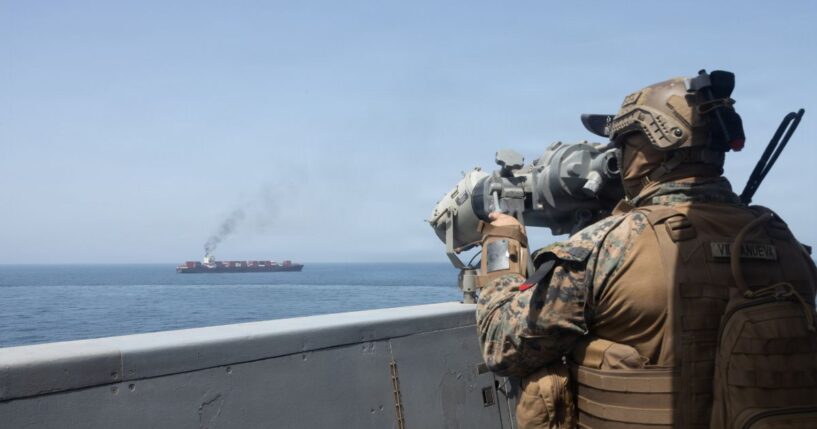 In this handout photo provided by U.S. Central Command, U.S. forces patrol the Arabian Sea near M/V Touska on April 20, 2026, after firing upon the Iranian-flagged vessel that the U.S. accused of attempting to violate the U.S. naval blockade of Iranian ports near the Strait of Hormuz.