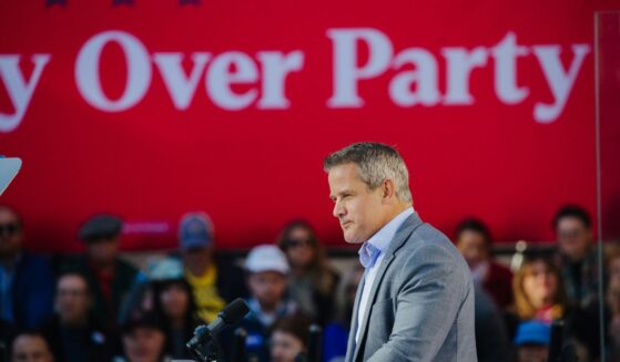 Former Rep. Adam Kinzinger speaks during a rally for Vice President Kamala Harris in Washington Crossing, Pennsylvania, on Wednesday, Oct. 16, 2024.