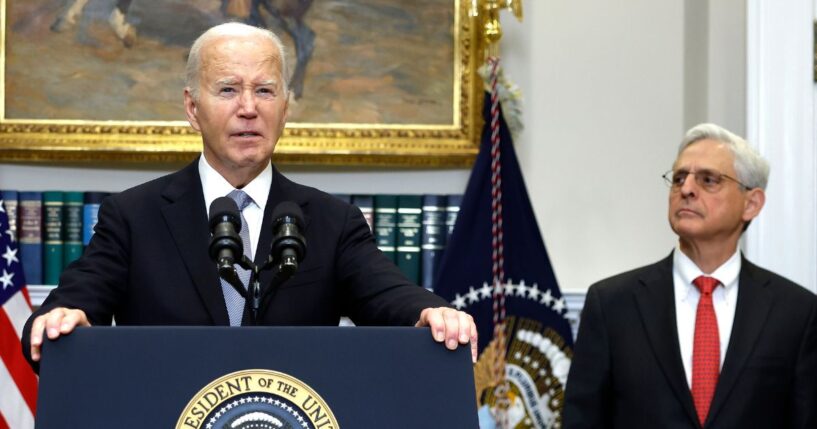 Then-President Joe Biden is flanked by Attorney General Merrick Garland in a July 2024 appearance. A new Department of Justice report calls the Biden administration's hostile actions against pro-lifers "shameful."