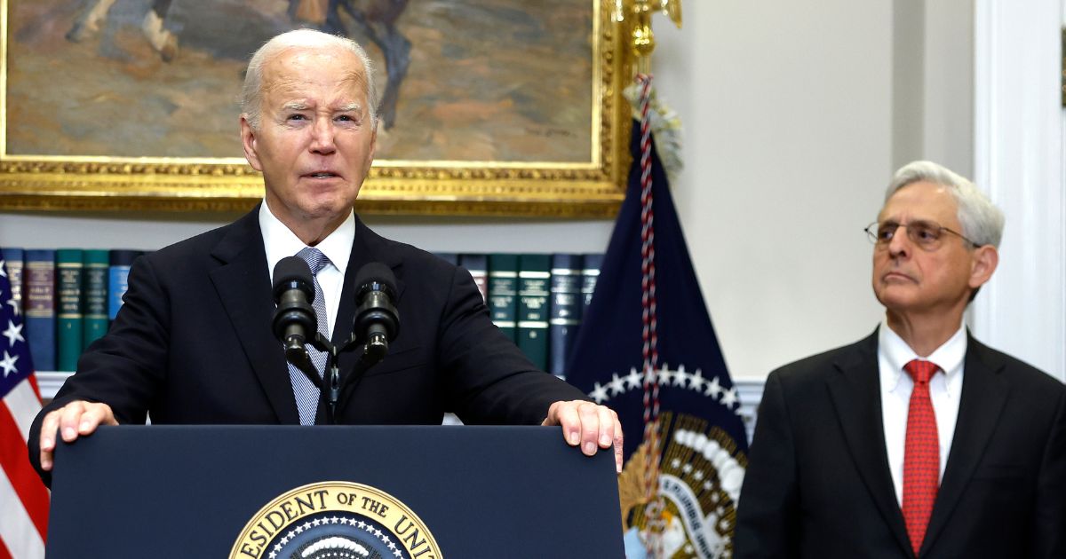 Then-President Joe Biden is flanked by Attorney General Merrick Garland in a July 2024 appearance. A new Department of Justice report calls the Biden administration's hostile actions against pro-lifers "shameful."