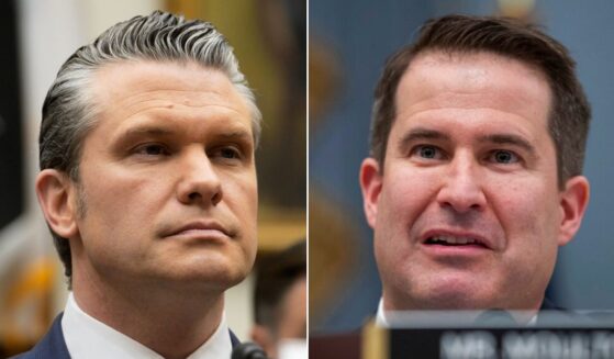 Rep. Seth Moulton, right, a Massachusetts Democrat, suggested on CNN that War Secretary Pete Hegseth deserves to be executed for his part in a September attack on a drug boat in the Caribbean.