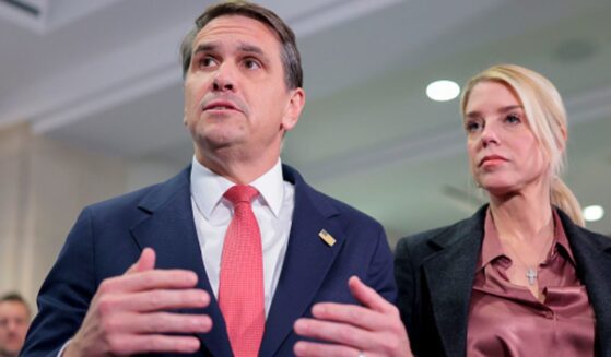 Deputy Attorney General Todd Blanche speaks beside Attorney General Pam Bondi on March 18, 2026.