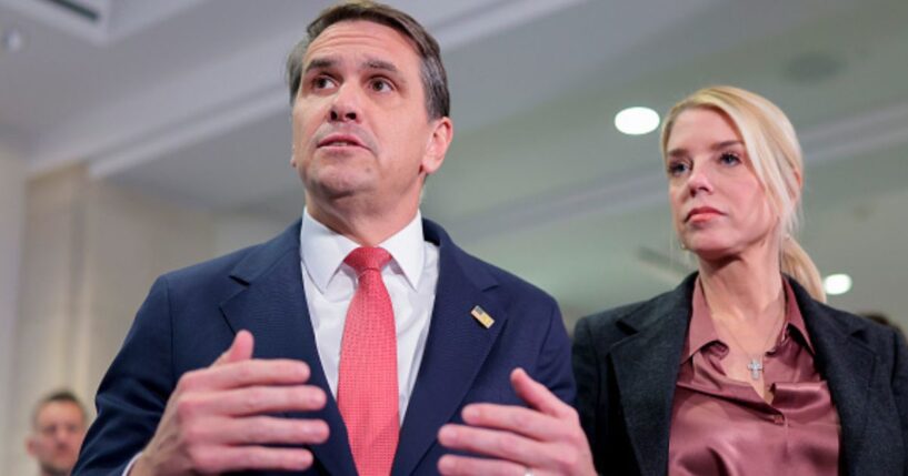 Deputy Attorney General Todd Blanche speaks beside Attorney General Pam Bondi on March 18, 2026.