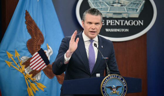 Secretary of War Pete Hegseth speaks at press room podium at the Pentagon on March 31, 2026.