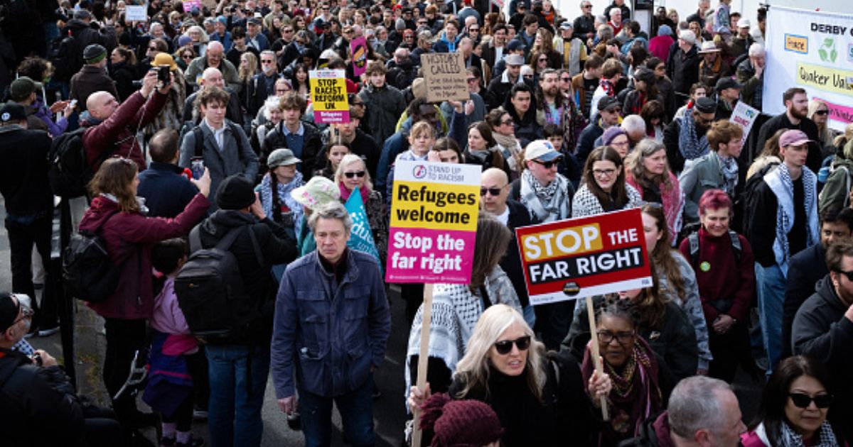 Stand Up To Racism protesters gather in outside on March 28, 2026.