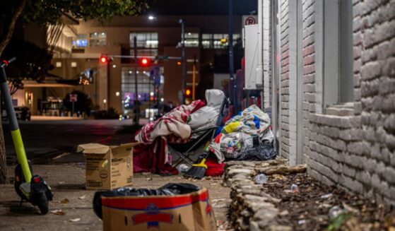 A southern street is strewn with trash.
