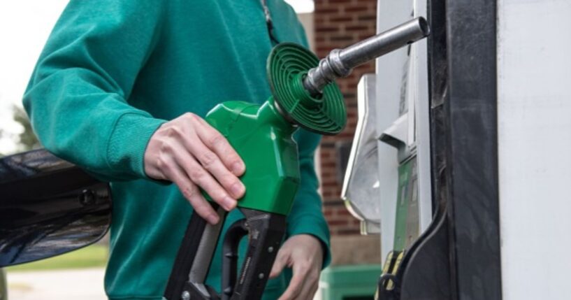A person pumps gas at a gas station on April 30, 2026.