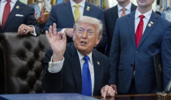 President Trump speaks in the Oval Office on April 30, 2026 flanked by administration officials.