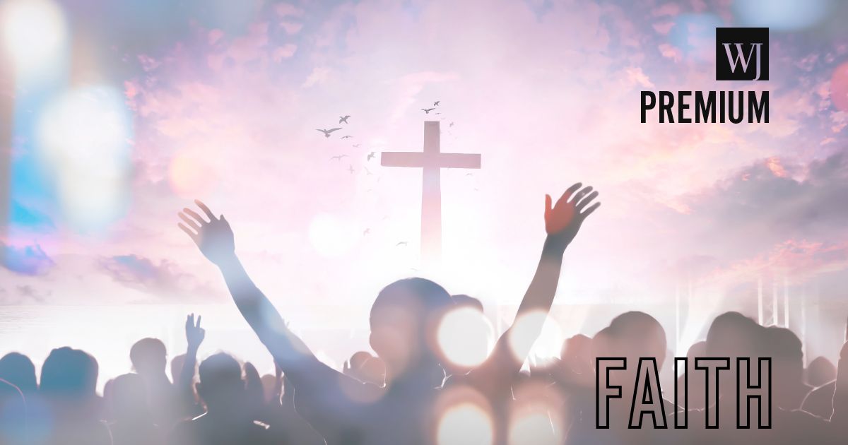 Christian people raise their hands in worship.