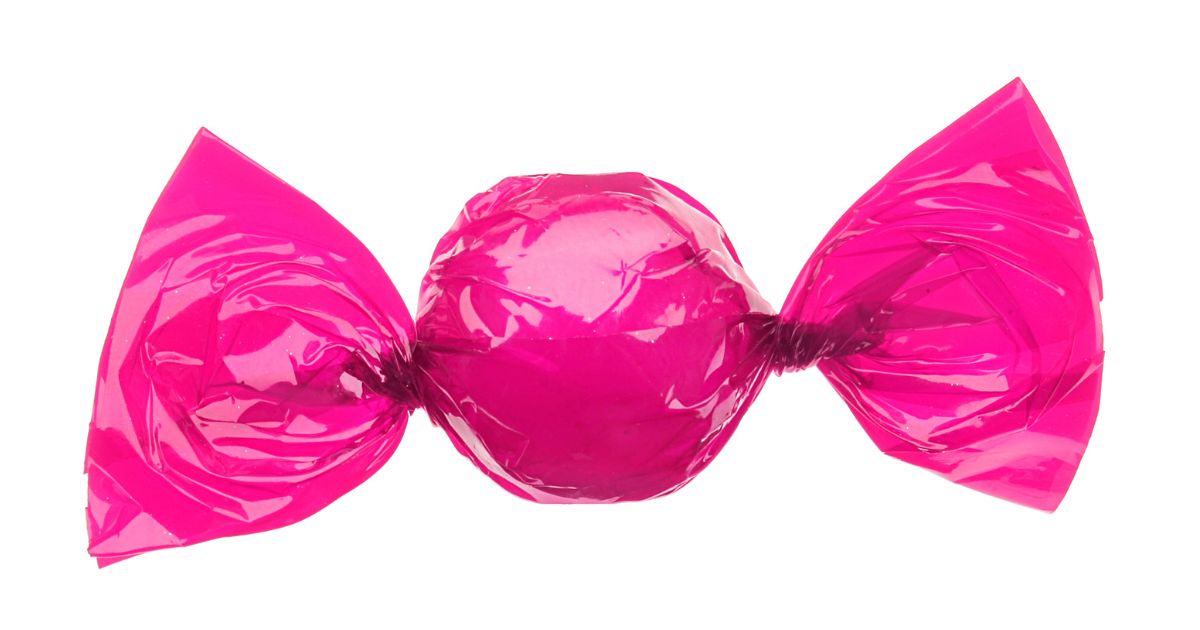 A candy wrapped in a pink wrapper.