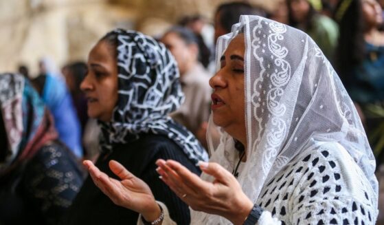 Coptic Christians attend a Palm Sunday Mass at the Monastery of Simon the Tanner in Cairo, Egypt, on April 5, 2026.
