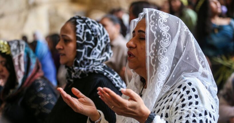 Coptic Christians attend a Palm Sunday Mass at the Monastery of Simon the Tanner in Cairo, Egypt, on April 5, 2026.