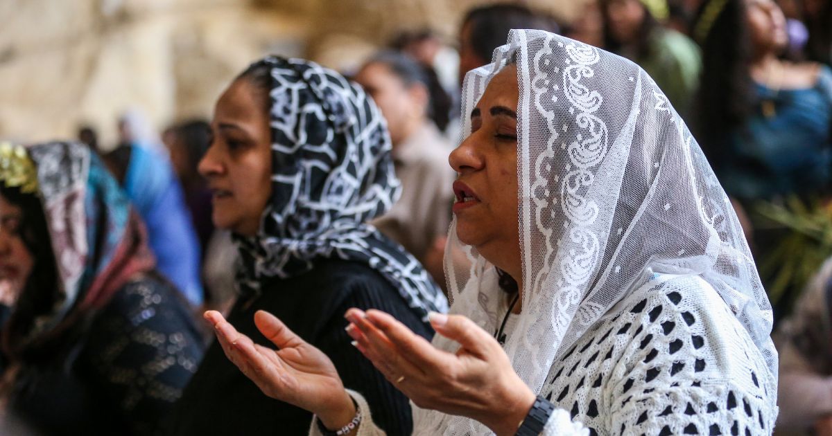 Coptic Christians attend a Palm Sunday Mass at the Monastery of Simon the Tanner in Cairo, Egypt, on April 5, 2026.