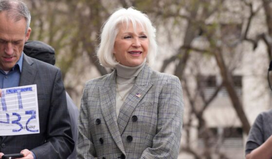 Mesa County Colorado clerk Tina Peeters walks on the steps of the state Capitol on April 5, 2022.