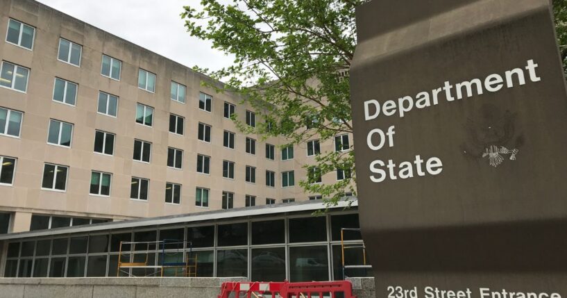 A sign for the Department of State stands outside a US diplomacy building in Washington, DC on April 19, 2019.