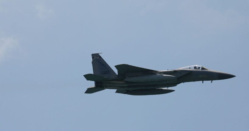 A F-15 fighter jet maneuvers before the Hyundai Air and Sea Show on May 28, 2021 in Miami Beach, Florida.