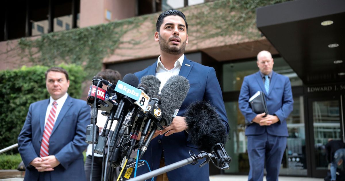 Ammar Campa-Najjar, a Democrat candidate who was running for congress in Rep. Duncan Hunter's district, speaks to reporters outside the Federal Courthouse in San Diego, California, on Dec. 3, 2019.