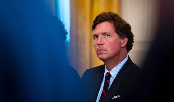 Former Fox News host Tucker Carlson looks on at a meeting with oil executives in the East Room of the White House on Jan. 8, 2026 in Washington, DC.