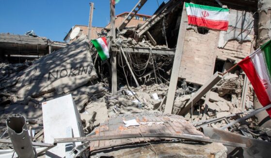 Iranian flags and graffiti seen at the remains of Sharif University of Technology in Tehran, Iran on April 7, 2026.