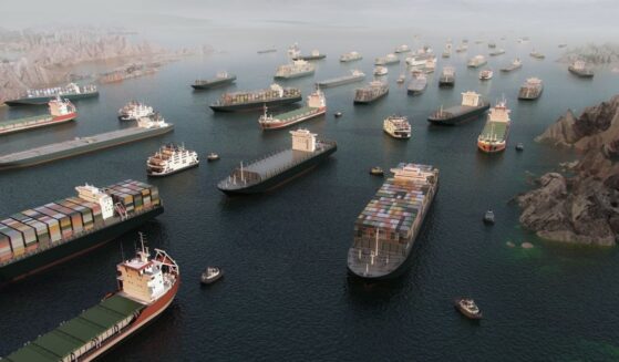 Cargo vessels sit in congested traffic in the Strait of Hormuz on March 25, 2026.