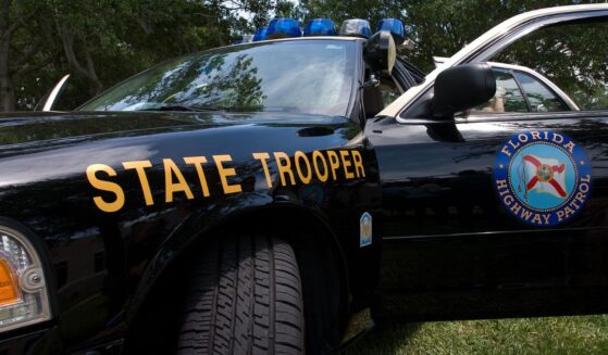 A Florida state trooper vehicle sits in the daylight.