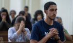 Nicaraguans attend a mass during celebrations in a church in San Jose, Costa Rica, on Dec. 7, 2023.