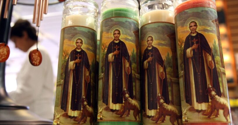 Candles depicting former President Barack Obama as a saint stand displayed at "Just For Fun" in San Francisco, California, on March 2, 2009.